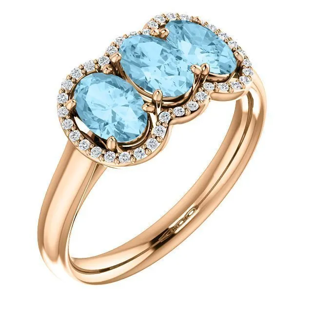 14KT GOLD 1.23 CTW AQUAMARINE & .10 CTW DIAMOND 3 STONE OVAL HALO RING