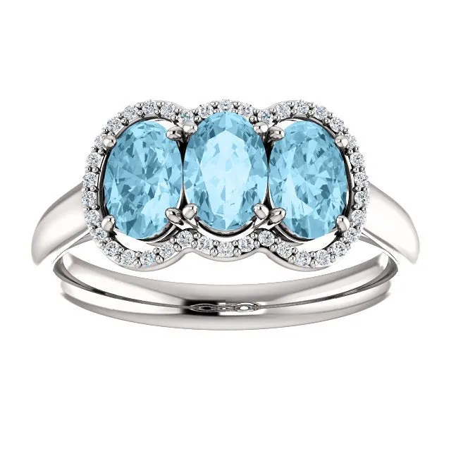 14KT GOLD 1.23 CTW AQUAMARINE & .10 CTW DIAMOND 3 STONE OVAL HALO RING