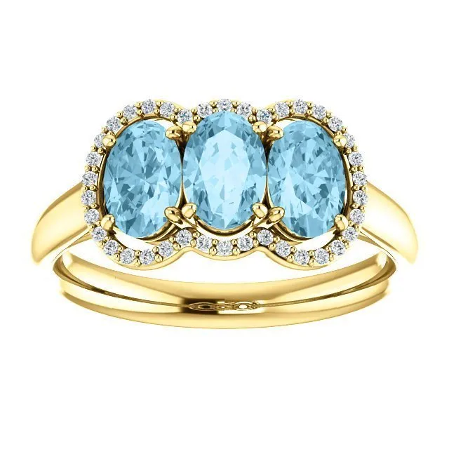 14KT GOLD 1.23 CTW AQUAMARINE & .10 CTW DIAMOND 3 STONE OVAL HALO RING