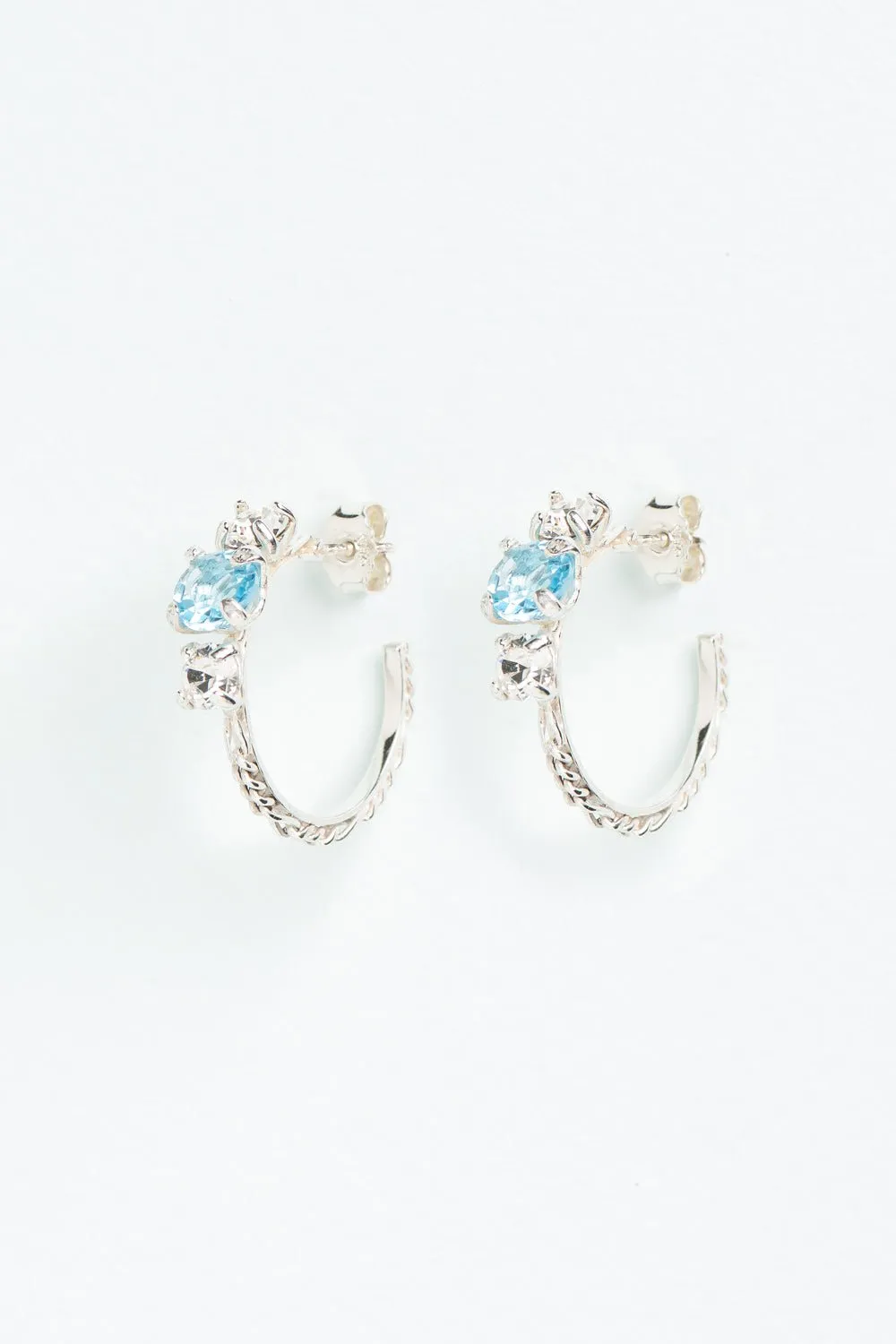 Wouters & Hendrix - Silver Hoop Earrings with Aquamarine and Clear Crystal Trilogy Stones